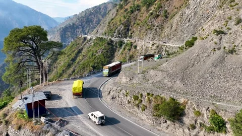 Drone shot of freight lorries and fuel tankers on narrow mountain pass India. Stock-Footage 337615470