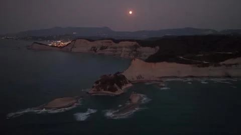 Drone shot of a full moon over the dramatic cliffs of Cape Drastis, Corfu, Stock Footage 319996701