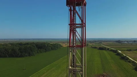 Drone shot of gas tower with flag of Ukraine. Beautiful natural rural landscape Video stock 219954047