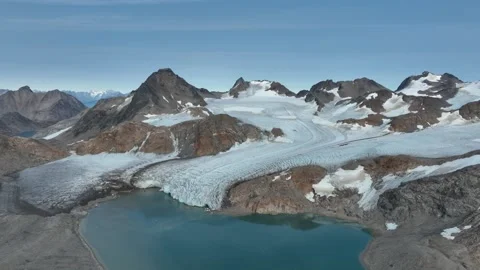 Drone shot of a glacier ending at the ocean near Kulusuk in East Greenland Video stock 332380498