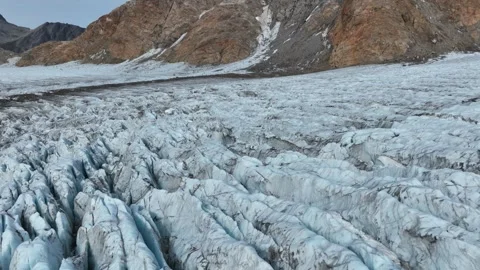 Drone shot of a glacier ending at the ocean near Kulusuk in East Greenland Video stock 332380694
