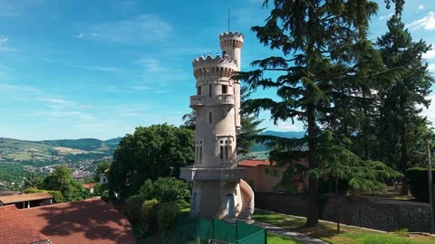 Drone shot going closer to the tower of jealousy in Saint Martin la Plaine city Stock Footage 310770999