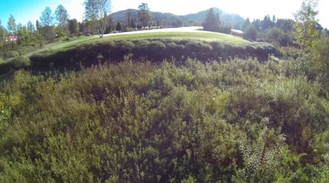 Drone shot of a golf course in the mountains Stock Footage 63865471