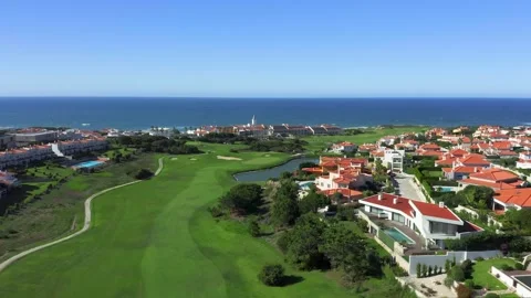 Drone shot of golf course with ocean backdrop in Portugal Video stock 252469236