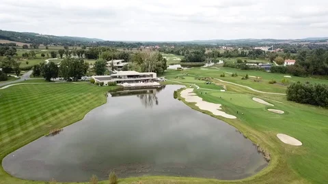 A drone shot of a golf field 스톡 동영상 115992751