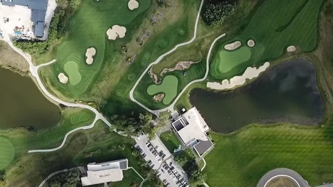 A drone shot of a golf field Видео 115993144