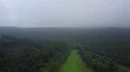 Drone shot gray clowdy foggy weather low mountain range valley forest 4k or 4k+ Resolution