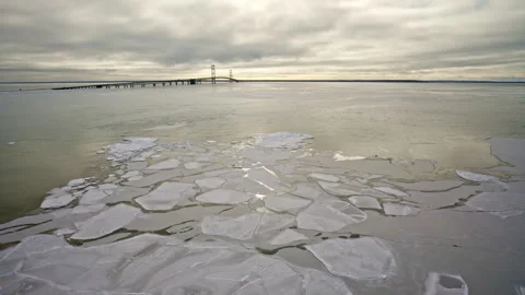 Drone shot of the Great Lakes surface displaying a mosaic of ice shapes and Stock Footage 337722283