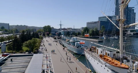 Drone shot of great warship berthed in port Stock Footage 89904659