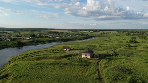 Drone shot of a green edge with trees and a river in summer on a sunny day Stock Footage 227122247