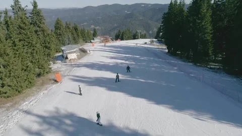 Drone shot of a group of snowboarders Stock Footage 222362072