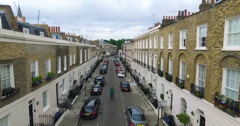 Drone shot of a guy on a bike in the city of London, England Stock Footage