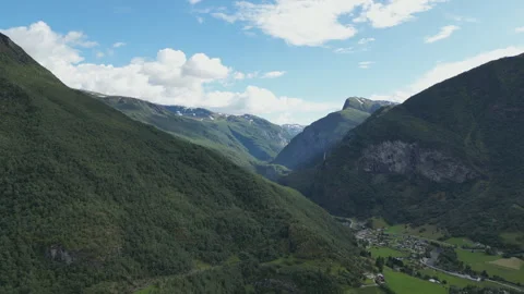 A drone shot of the high mountains and a remote village in Norway. Stock Footage 258968918