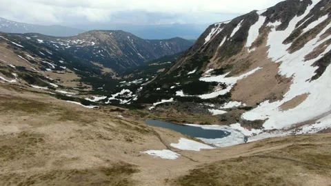 Drone shot of the highest mountain lake in Ukraine is Berbeneskul. Ukrainian Stock Footage 168749486