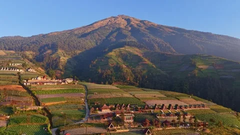 Drone shot of highland countryside with A-frame cottages, Stock Footage 343425341
