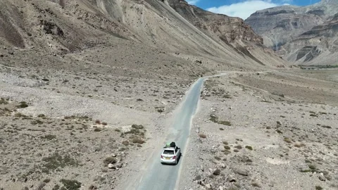 Drone Shot of Highway Passing Through Himalayan Mountain Valley with Vehicle Stock Footage 330319516