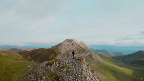 Drone shot of hiker on mountain cloudy top 스톡 동영상 133225631