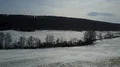 Drone shot hills and valley white farmland winter landscape in mountain range 4k or 4k+ Resolution
