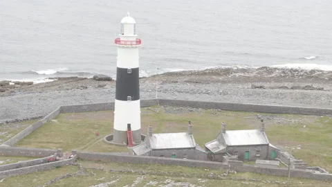 Drone shot of Historic Lighthouse on Aran Island, Ireland Stock Footage 224819436