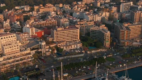 Drone shot of hotel in the rays of dawn by the sea Stock Footage 119441206