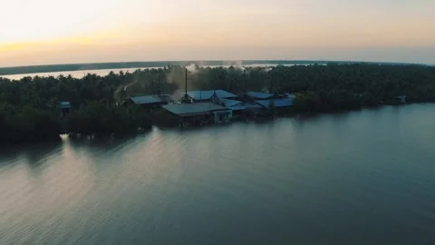 Drone shot of human factory inside Jungle, Ben Tre Mekong Delta in Vietnam Stock Footage 242846843