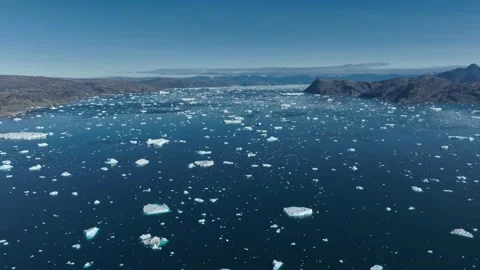 Drone shot of icebergs floating in a large fjord of East Greenland Stock Footage 332370979