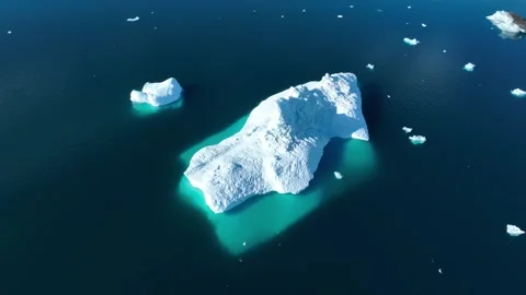 Drone shot of icebergs floating in a large fjord of East Greenland Stock Footage 332371627