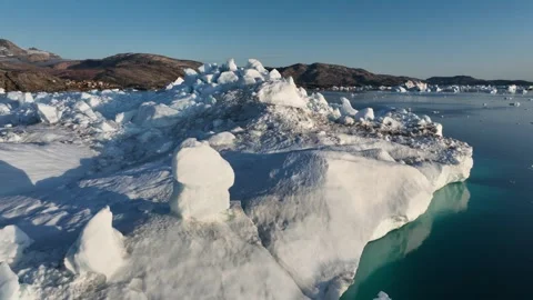 Drone shot of icebergs floating in a large fjord of East Greenland Stock Footage 332373787