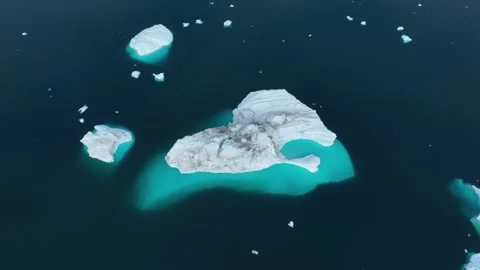 Drone shot of icebergs floating in a large fjord of East Greenland Stock-Footage 332374532