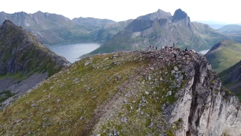 Drone shot of iconic razor sharp mountain peak and fjord in Northern Norway Stock Footage 340507112