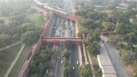 Drone shot of a Indian railways train on bridge at Red Fort New Delhi India  Stockbeeldmateriaal 223353594