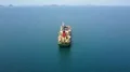 Drone shot Indonesian container ship on Flores Sea near Labuan Bajo coastline 4k or 4k+ Resolution