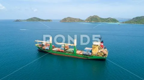 Drone shot Indonesian container ship on Flores Sea near Labuan Bajo coastline Stock Photos