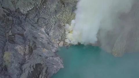 Drone shot inside of Ijen volcano framing burning sulphur. Indonesia. 스톡 동영상 101905789