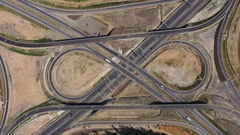 Drone shot of intersecting roads and circular ramps Stock Footage 321771433