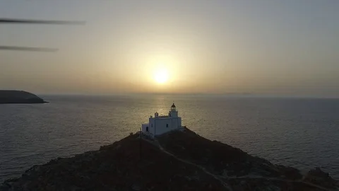 Drone shot of Island Lighthouse at Sunset in Greece HD Stock Footage 128043394