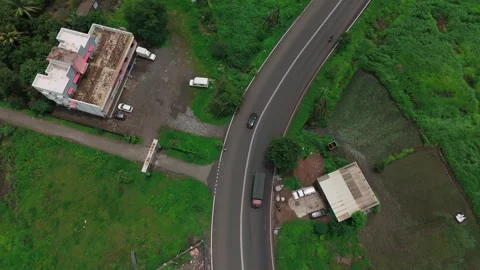 Drone Shot of Isolated Road Through Dense Greenery Stock Footage 307771079