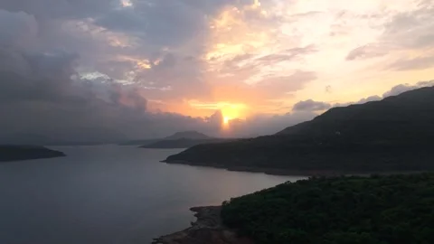 Drone shot of lake during sunset with dramatic clouds 4K25 스톡 동영상 332893296