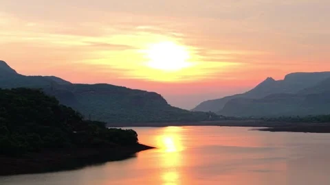 Drone shot of lake during sunset with dramatic clouds 4K60 스톡 동영상 332893364