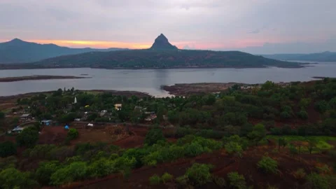 Drone shot of lake during sunset with dramatic clouds 4K30 스톡 동영상 332893401