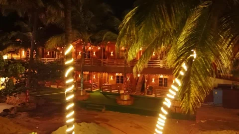 Drone shot lanterns glow by evening timber resort Stock Footage 307279588