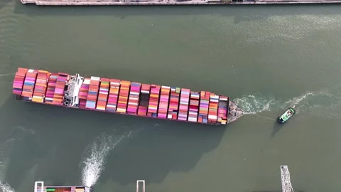 Drone shot of a large container ship entering or leaving port Stock Footage 295748464