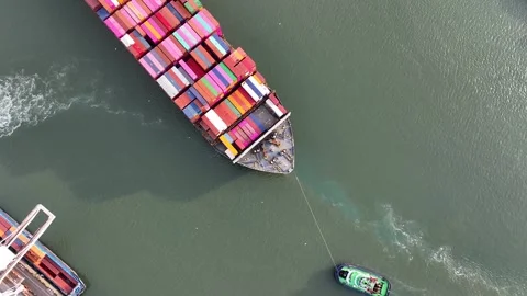 Drone shot of a large container ship entering or leaving port Stock Footage 296368469