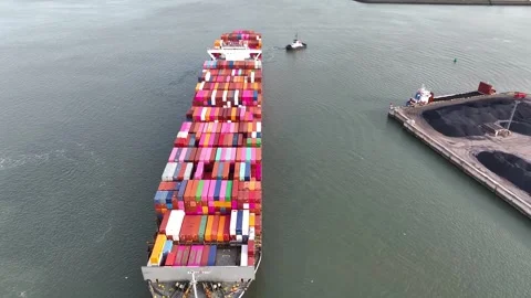 Drone shot of a large container ship entering or leaving port Stock Footage 329128156