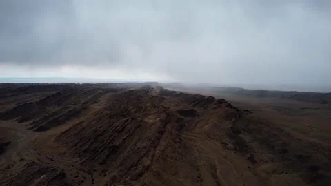 Drone Shot Of Layered Strata In Harsh Desert Light, Noyon Uul, Mongolia Stock Footage 333550921