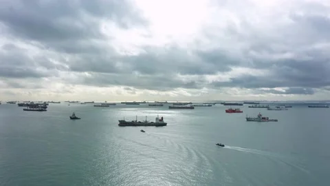 Drone shot of light shining through clouds, Singapore anchorage Stock Footage 157572056