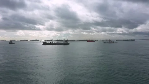 Drone shot of light shining through clouds, Singapore anchorage Stock Footage 157572064