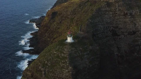 Drone shot of lighthouse at the edge of a cliff, Hawaii Stock Footage 126604466