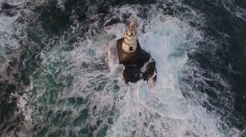 Drone shot of a lighthouse in open sea during sea storm Stock Footage 58471643
