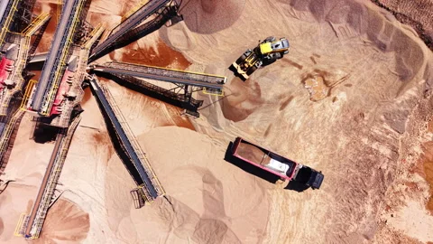 Drone shot of loader and truck at sand quarry site 스톡 동영상 345153644